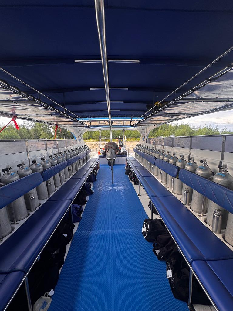 Spacious seating and dive gear storage inside Blue Marlin speedboat in Khao Lak