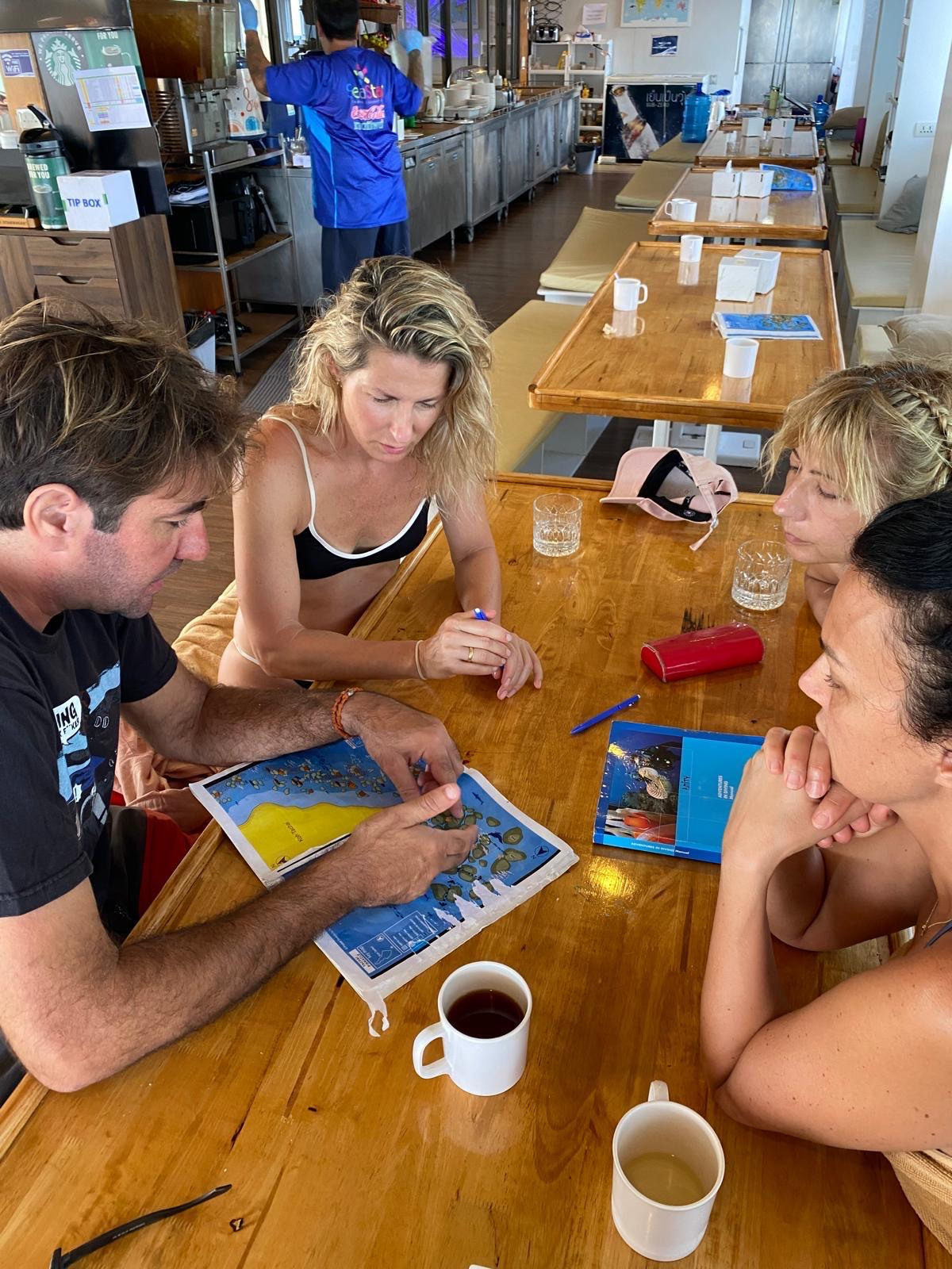 YU Dive instructor giving an Open Water Diver course briefing onboard a dive boat in Khao Lak