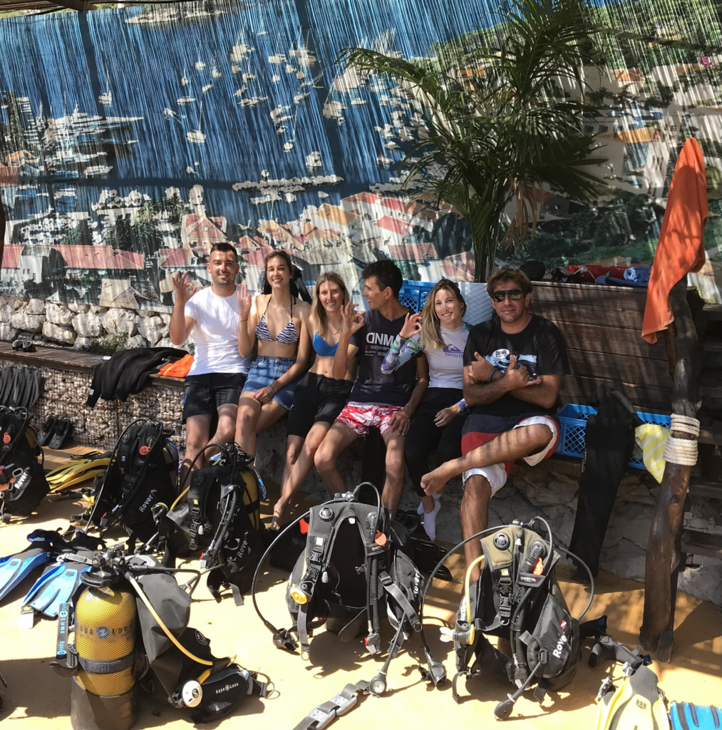 Happy students and instructor at Yu Dive during PADI Diving Courses in Khao Lak