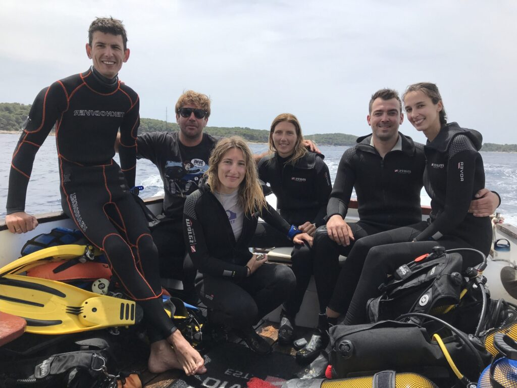 Open Water Diver Course Khao Lak students and instructor on a dive boat
