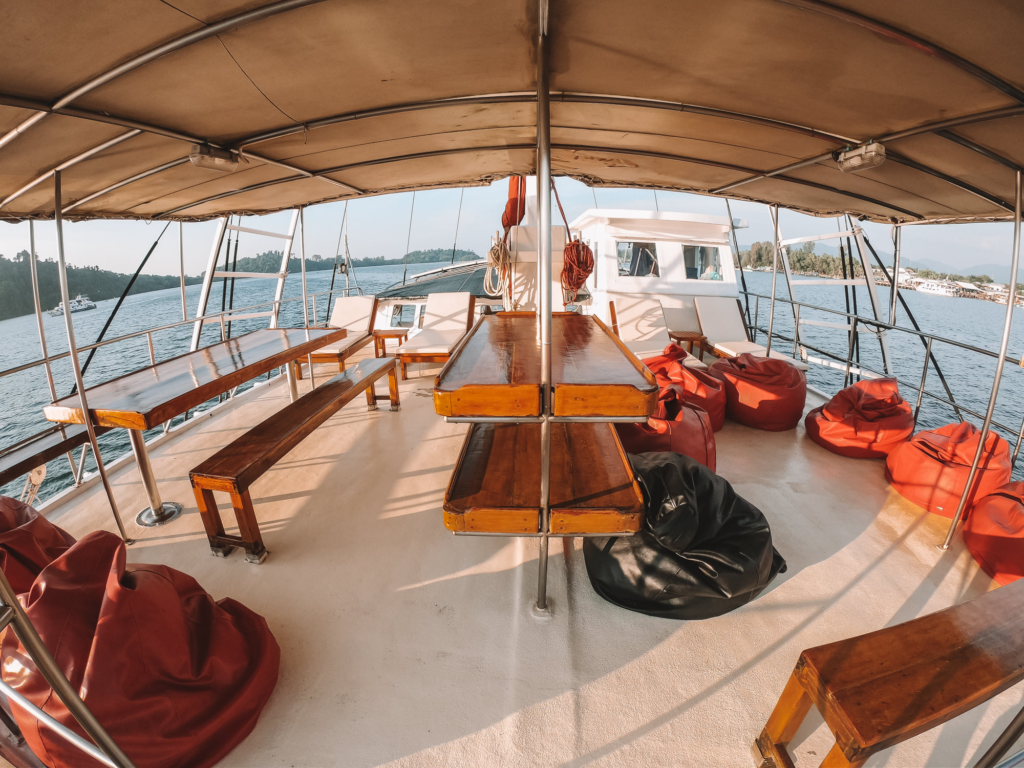Shaded sun deck aboard Phinisi liveaboard