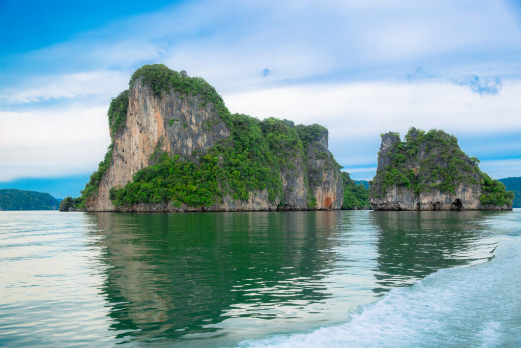 Two limestone islands rising from the waters of Phang Nga Bay