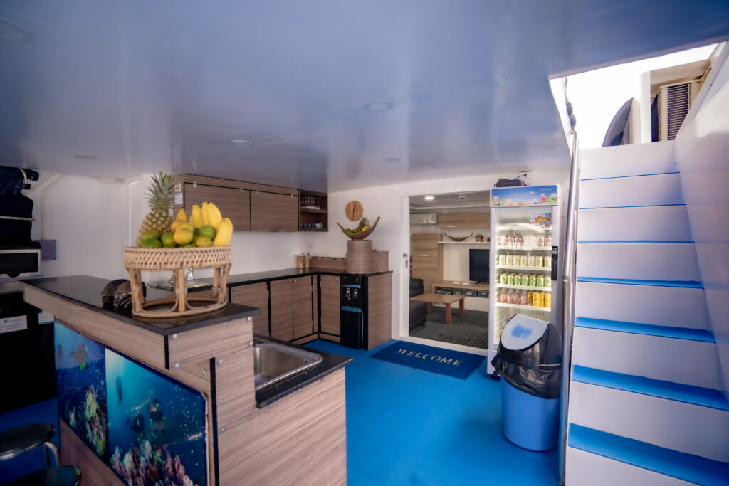 Outdoor deck with service counter and saloon entrance on Bavaria liveaboard